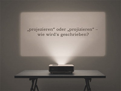 Projektor, der Frage an die Wand wirft; erstellt mit Mistral Le Chat Pro